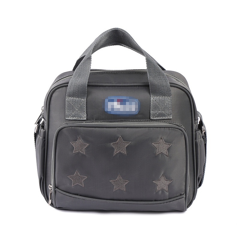 Set multi-pezzo con motivo a stelle per borsa fasciatoio, borsa da viaggio impermeabile con custodia termica per biberon, fasciatoio e pochette per accessori.