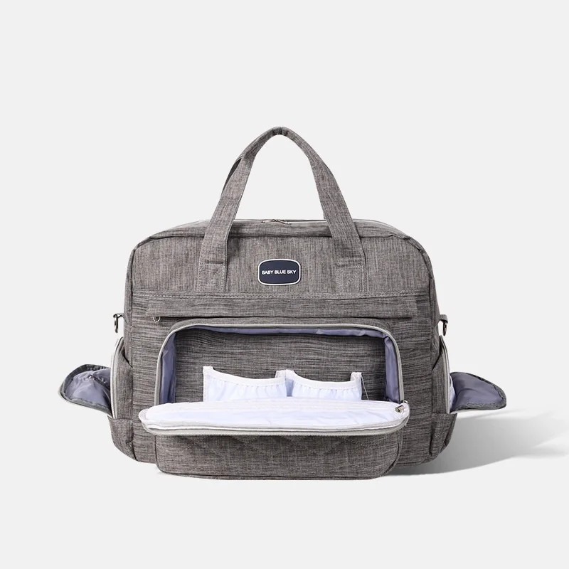 Borsa fasciatoio trapuntata multi-scomparto, impermeabile, ideale per i viaggi, con fasciatoio imbottito e tasche termiche.