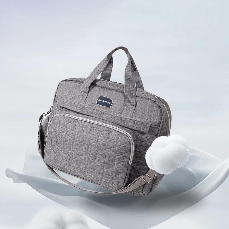 Borsa fasciatoio trapuntata multi-scomparto, impermeabile, ideale per i viaggi, con fasciatoio imbottito e tasche termiche.